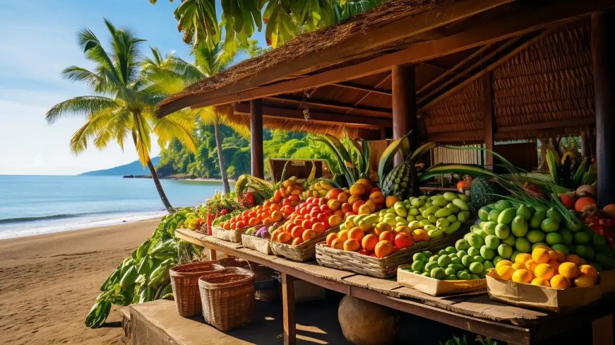 Elderly couple enjoys breakfast in lush Costa Rican garden with ocean view and morning sunlight.