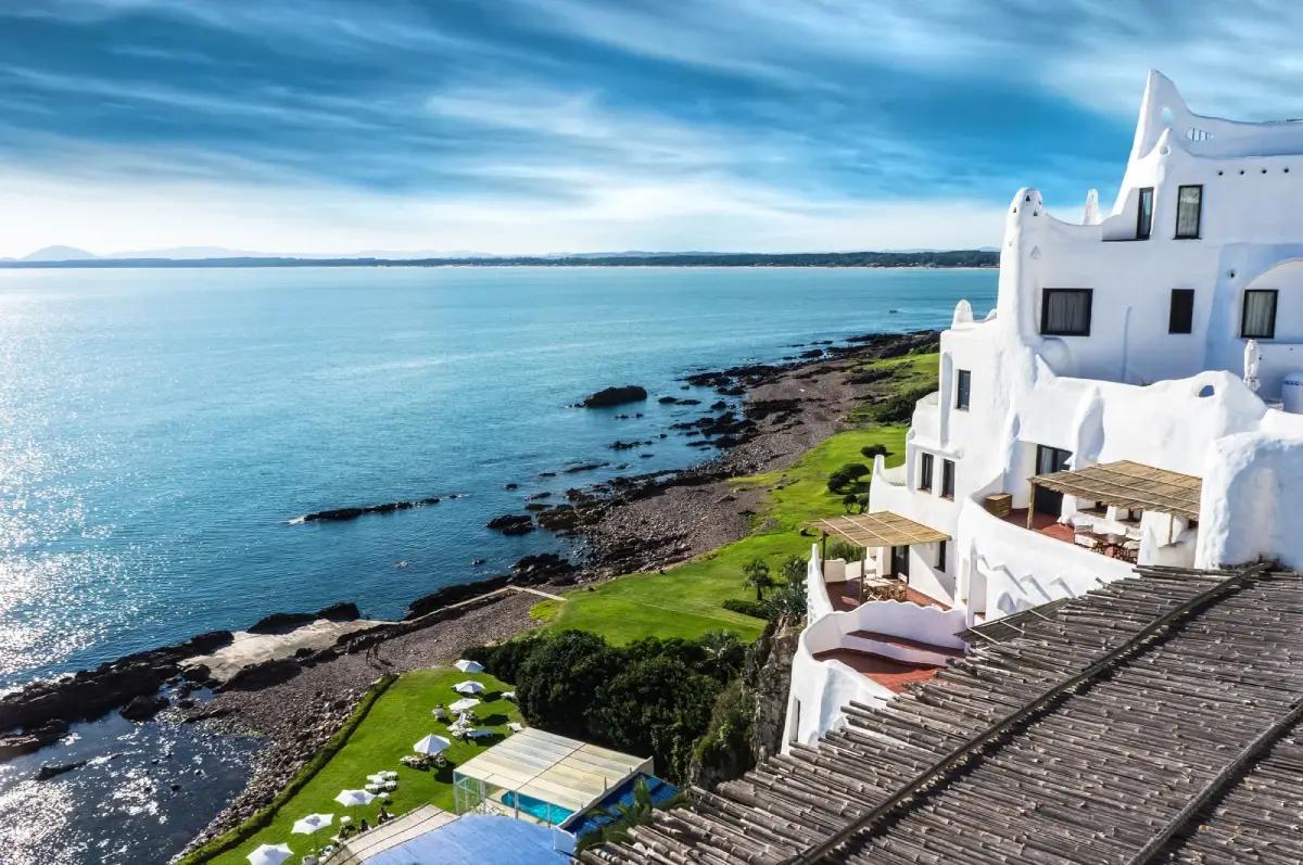 Serene street in Uruguay with retirees enjoying a tranquil afternoon on a sunny day.