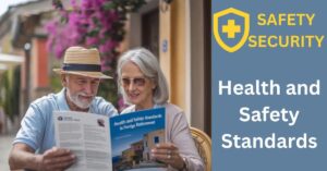 Retiree couple in Mediterranean café, enjoying espresso while reviewing health and safety brochure.